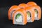 Portion of fresh philadelphia sushi roll on black background