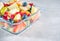Portion fruit salad in a bowl. Healthy meal