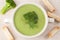 Portion of green broccoli cream soup restaraunt