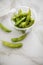 Portion Japanese Edamame soy beans in plastic take away tray bowl