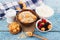 Portion of oatmeal in the bowl with berries