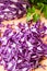 Portion of Red and parsley Coleslaw on white background.