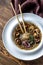 Portion of shiitake ginger soup on the wooden table