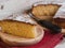 Portion of a sponge cake on a wooden plate