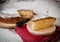 Portion of a sponge cake on a wooden plate