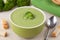 Portion of vegan green broccoli cream soup with