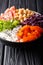 Portion of a vegetarian Buddha bowl with red cabbage, tomatoes,