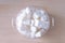 Portion of white Sugar in a bowl on wooden background