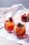 Portioned fruit dessert in glass cups kremankah - jelly with fruit and mint, low-calorie summer snack.