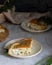 portioned rustic pie with cottage cheese and herbs