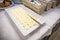 Portions of butter to spread on bread on a plate