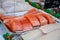 Portions filet fresh red Scottish salmon fish on market