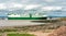 Portishead beach from Esplanade Road with passing large vehicle carrier in the background, UK