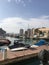 Porto Arabia on the artificial island of The Pearl, with a view of the city skyline in the background in Doha