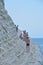 PORTO EMPEDOCLE, ITALY - AUGUST, 2015: Some tourists in the beach Scala dei Turchi, one of the most beautiful beaches in Sicily, o