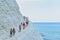 PORTO EMPEDOCLE, ITALY - AUGUST, 2015: Some tourists in the beach Scala dei Turchi, one of the most beautiful beaches in Sicily, o