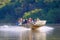 PORTO JOFRE, MATO GROSSO, BRAZIL, JULY 27, 2018: Tourists and guide on boat tour for Jaguar wildlife watching, Pantanal