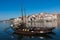 PORTO, PORTUGAL - JANUARY 18,2018: Boats carrying barrels of porto wine seen docking at river bank. Panorama View on Porto, Duoro