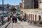 Porto, Portugal - January 20, 2020: Crowds of tourists walk along the Ribeira district, Porto`s historical area overlooking the