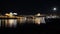 Porto, Portugal: Panoramic night view of the historic cityand famous Dom Luiz bridge, and their reflections over Douro river