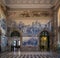 Porto, Portugal - Sao Bento train station interior with beautiful azulejos blue tiles on the wall depicting historic scenes