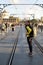 Porto, Portugal - September 17, 2023. Young Woman traveller and pedestrians on the Ponte D. Luis I. Douro River and terracota