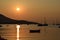 Porto Rafti bay port with little boats in the early morning light with sail boats red colour