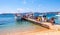 Porto San Paolo, Sardinia, Italy - Tourists returning from Isola Tavolara island cruise in yacht marina of Porto San Paolo resort