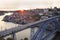 Porto skyline and Douro River at sunset with Dom Luis I Bridge on the foreground