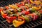 portobello mushroom skewers on a grill with colorful peppers