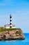 Portocolom Lighthouse on a cliff.