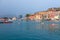 PORTOFERRAIO, ELBA ISLAND, ITALY - SEPTEMBER 17, 2018: Beautiful view of the port of the city Portoferraio. Bright red boat in the