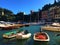 Portofino Italian village in Liguria region, Italy. Boats, sea, water, tourism and colours