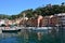 PORTOFINO, ITALY - JUNE 13, 2017: beautiful panorama of Portofino with colorful houses, luxury boats and yacht in little bay harbo