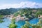 Portofino landscape,   view from top to boats on water, colorful houses and villas, slopes of the mountains  in Portofino, Italy.