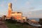 portopalo sicily italy red white castle shot from side next to pool and ocean 132 p