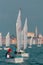 PORTOROZ, SLOVENIA, 20.10.2020: Sailors in a sailboat on a competition in Optimist class on open waters on the sea during sunny