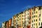 Portovenere: view of colorful buildings with blue sky and clouds