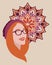 Portraint of happy european redhead woman in glasses on round pattern ornament