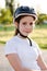 Portrait of an 11 year old girl wearing a protective bicycle helmet. Child in a safety helmet for rollerblading or skateboarding