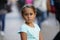 Portrait of 4 year old girl on the blurred background of a shopping street