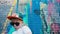 Portrait of a 5-year-old street dancer, A cool 5 year old child dances in sunglasses near a brick wall with graffiti