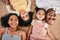 Portrait, above and happy family on a floor, smile and bonding in a living room together. Top view, love and face of