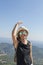 Portrait of active blond caucasian girl at Dentelles de Montmirail chain of mountains in Provence in Vaucluse, France