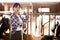 Portrait of active chinese female employee working in cowshed on farm