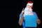 Portrait actor male in cap and beard of Santa Claus with a sheet of paper for notes in the hands