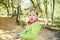 Portrait of adorable 5 year old boy playing freely in nature to improve his motor development