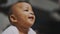 Portrait of adorable african american black baby. Baby laughing while having tummy time