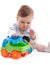 Portrait of adorable baby boy playing with toys