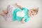 Portrait of adorable baby girl with blue eyes and cute hair looking at the camera calmly with curiosity